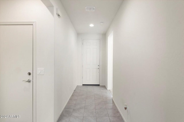 hallway with light tile patterned floors