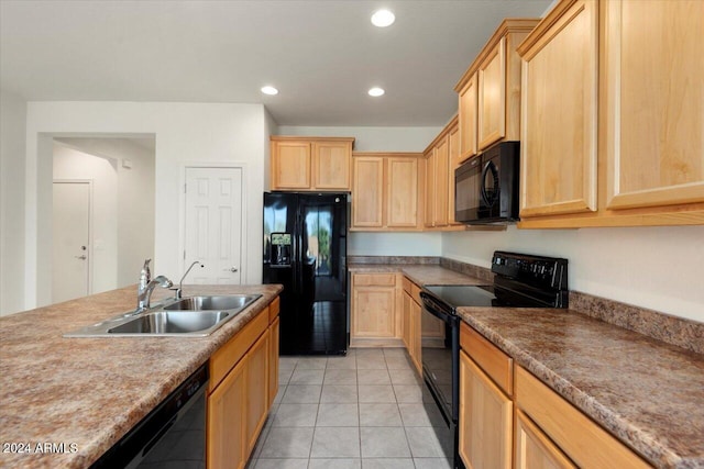 kitchen with light brown cabinets, black appliances, sink, and light tile patterned floors