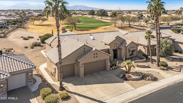 bird's eye view with golf course view, a residential view, and a mountain view