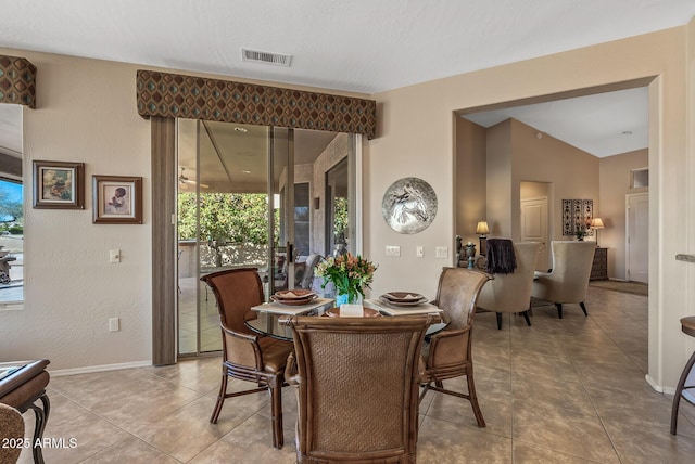 dining room with visible vents, baseboards, and tile patterned floors