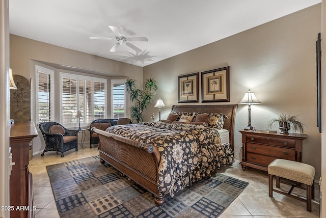 bedroom featuring a ceiling fan and light tile patterned floors