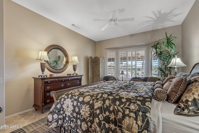 bedroom with light tile patterned floors, baseboards, visible vents, lofted ceiling, and ceiling fan