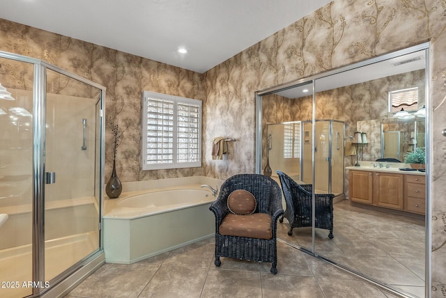 bathroom with vanity, visible vents, a shower stall, a bath, and tile patterned floors