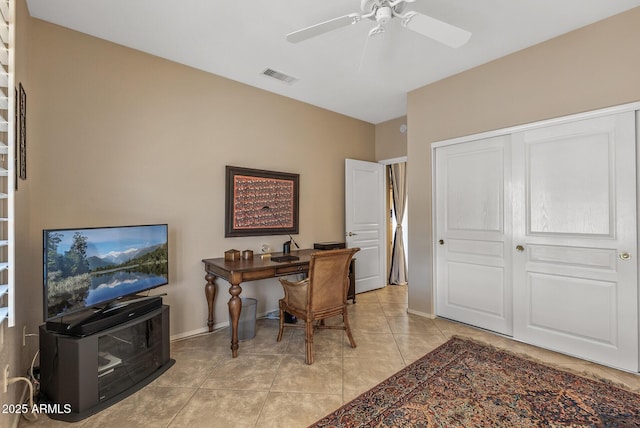 office area featuring a ceiling fan, visible vents, baseboards, and light tile patterned flooring