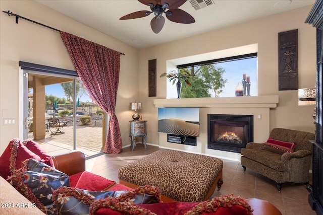 living room with ceiling fan, a healthy amount of sunlight, and tile patterned flooring