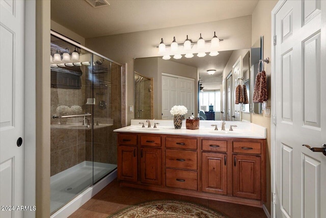 bathroom with vanity, tile patterned floors, and walk in shower