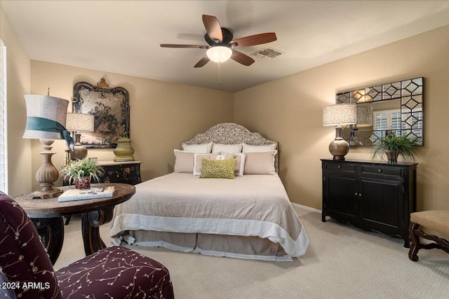 bedroom featuring ceiling fan and light carpet