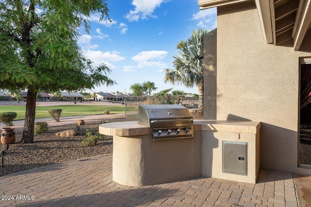 view of patio / terrace featuring an outdoor kitchen and area for grilling