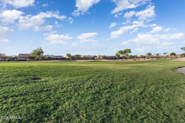 view of home's community featuring a lawn