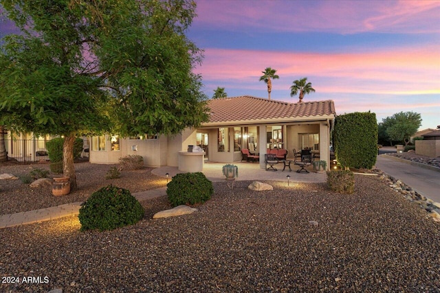 view of front of home featuring a patio