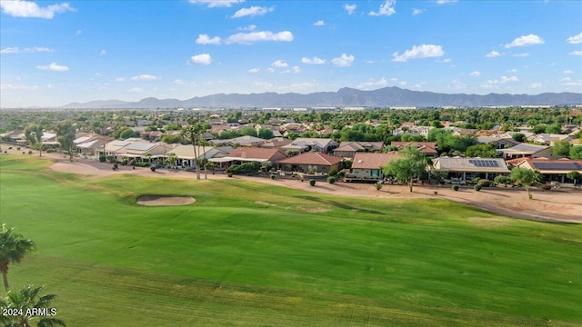 view of home's community featuring a yard and a mountain view