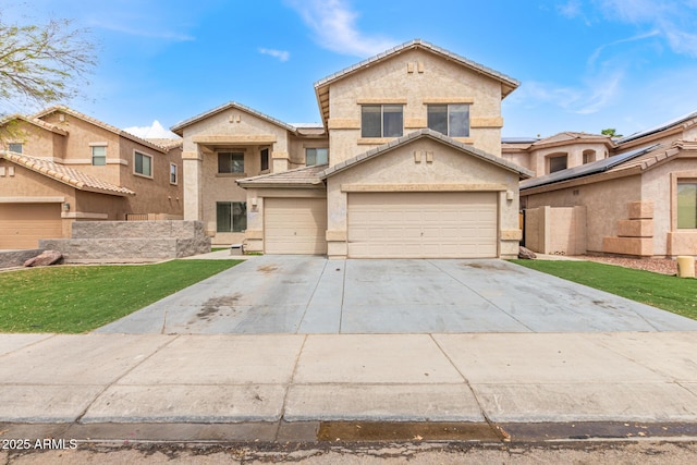 traditional-style house with stucco siding, driveway, a front lawn, an attached garage, and a tiled roof