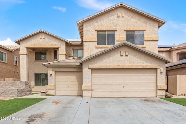 traditional-style home with driveway, stucco siding, and a tiled roof