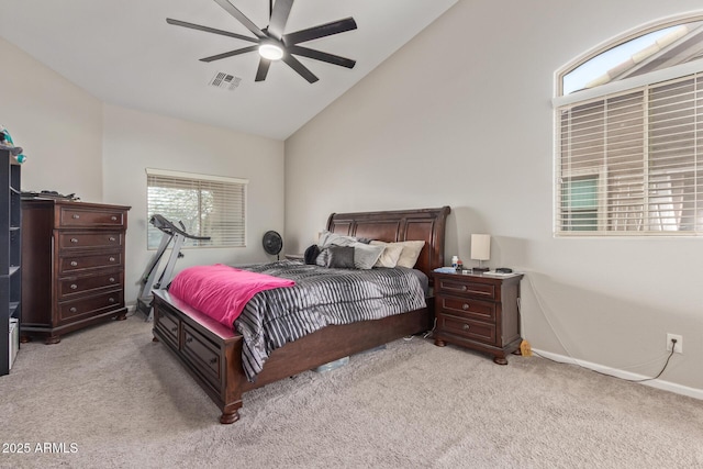 bedroom with light carpet, baseboards, a ceiling fan, and high vaulted ceiling