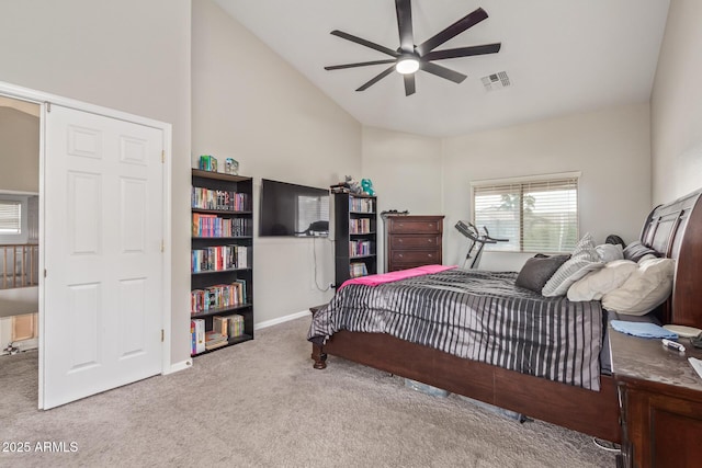 bedroom with carpet, baseboards, high vaulted ceiling, and a ceiling fan