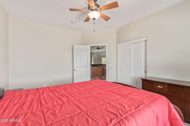 bedroom with a ceiling fan and a closet