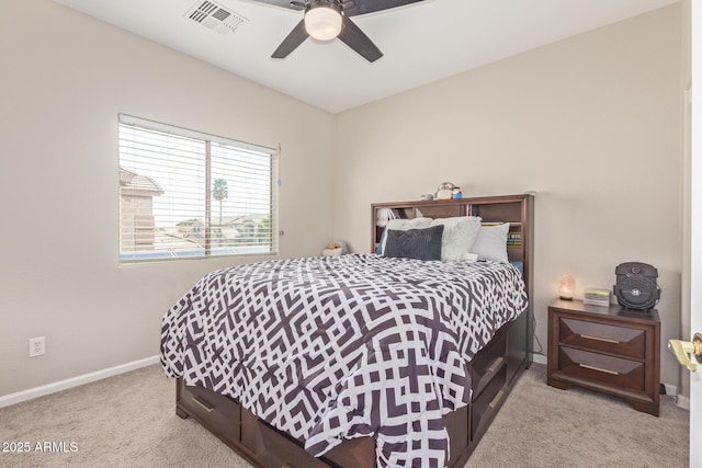 carpeted bedroom featuring baseboards and ceiling fan