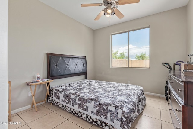 bedroom with baseboards, light tile patterned flooring, and ceiling fan
