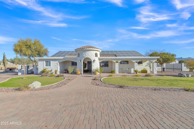 view of front of home with solar panels