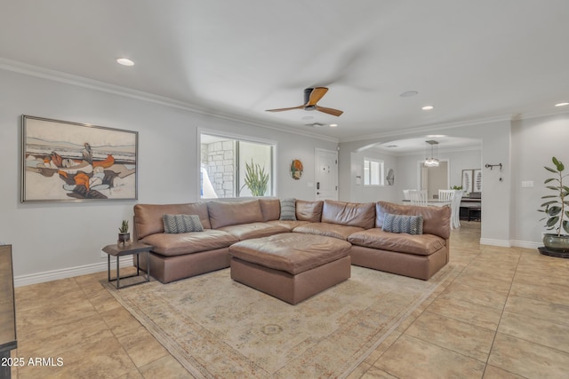 living room featuring ceiling fan and ornamental molding