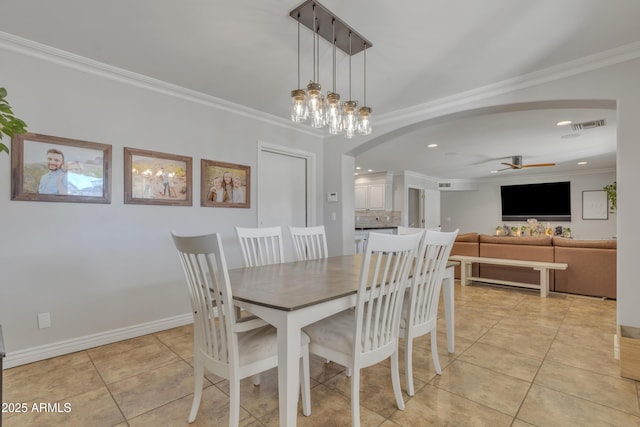 dining space featuring ceiling fan with notable chandelier, light tile patterned floors, and ornamental molding