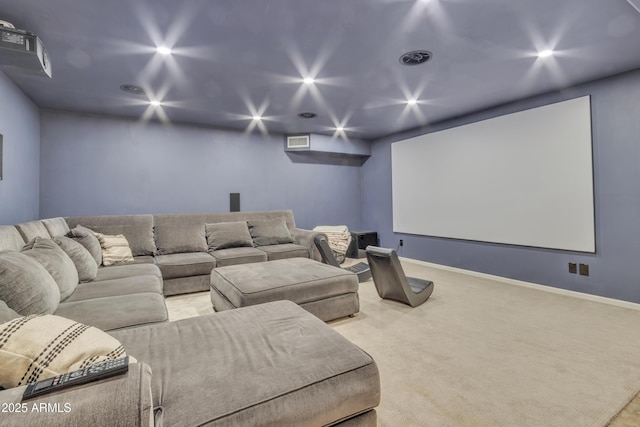 cinema room featuring light carpet