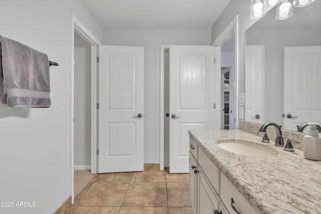 bathroom with tile patterned flooring and vanity