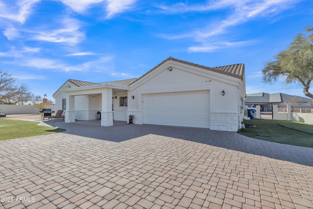 view of front of property with a garage and a front lawn