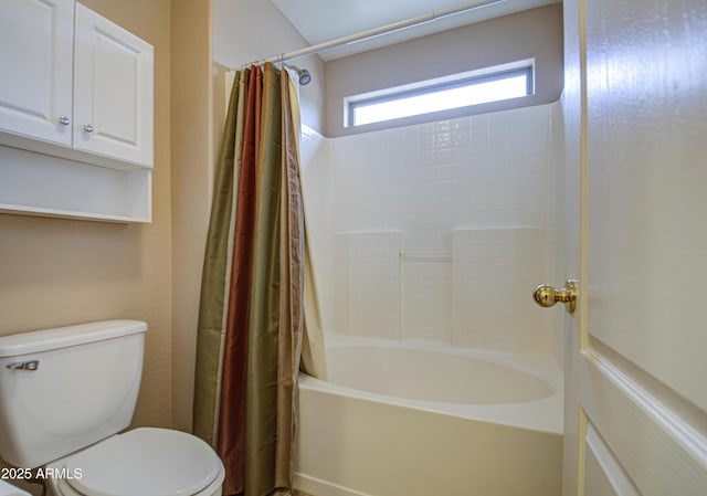 bathroom featuring toilet and shower / bath combo