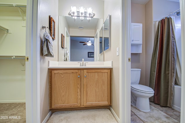 full bath with a shower with shower curtain, toilet, a spacious closet, and vanity