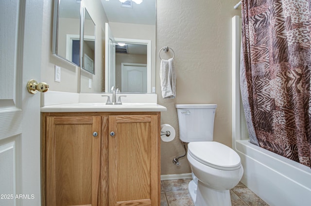 bathroom with vanity, shower / bath combo, tile patterned flooring, toilet, and a textured wall