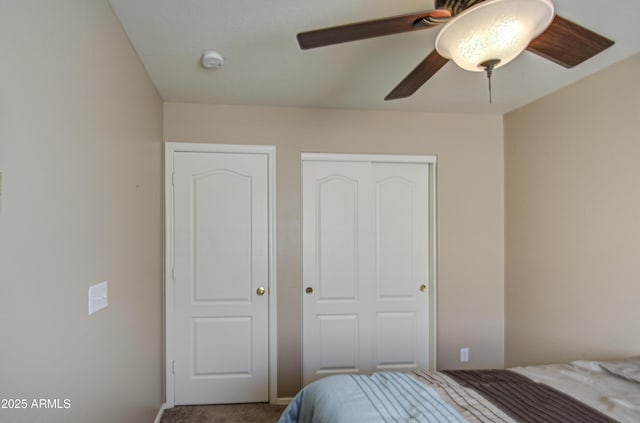 bedroom featuring carpet flooring, a closet, and ceiling fan