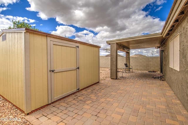 view of shed with a fenced backyard