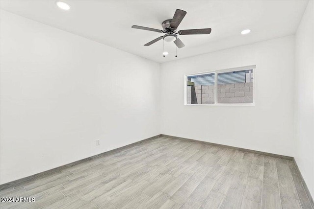 unfurnished room featuring light wood-type flooring, ceiling fan, and recessed lighting