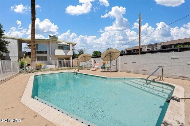 view of pool featuring a patio area