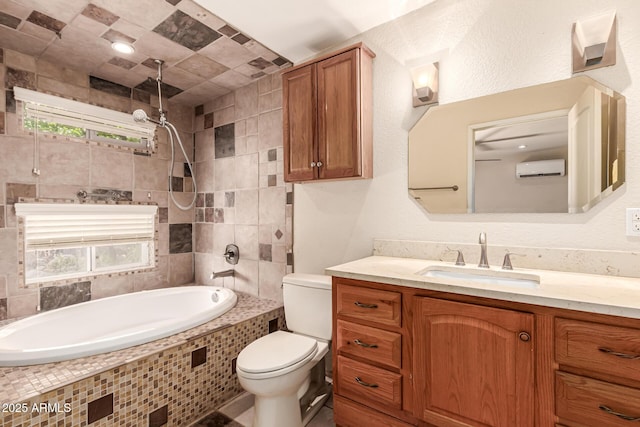 bathroom featuring vanity, a combined bath / shower with rainfall shower, toilet, and a wall unit AC