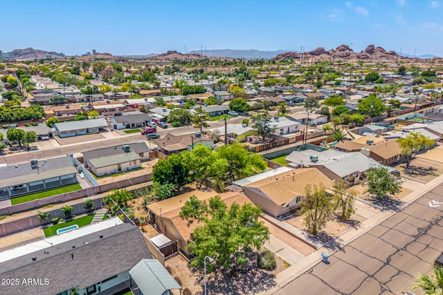birds eye view of property with a mountain view and a residential view