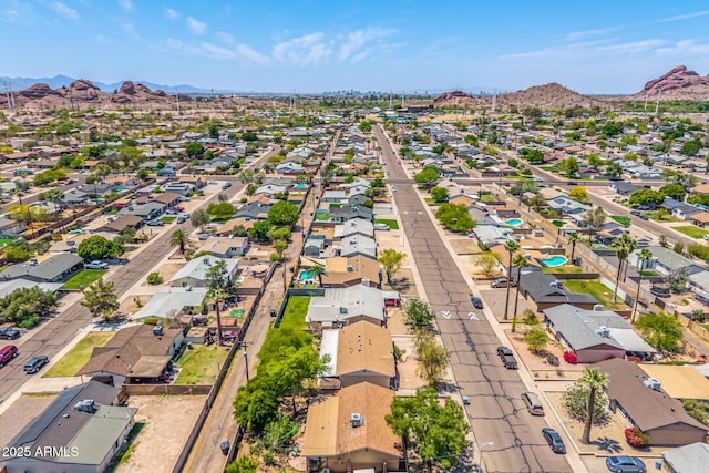 drone / aerial view featuring a mountain view and a residential view