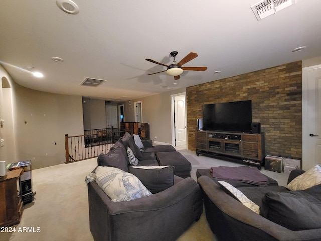 carpeted living room with visible vents and a ceiling fan