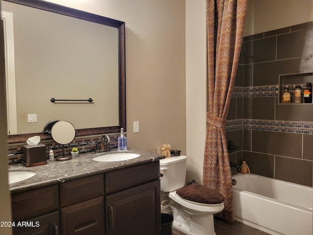 bathroom with double vanity, toilet, shower / bath combo, a sink, and tile patterned flooring