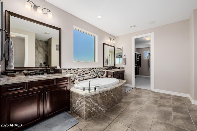 bathroom with a shower, visible vents, vanity, a bath, and tile patterned floors