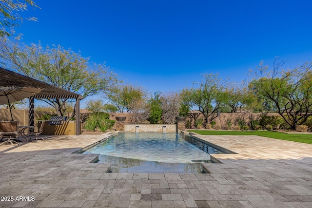 view of swimming pool with a patio area, a fenced backyard, and a fenced in pool