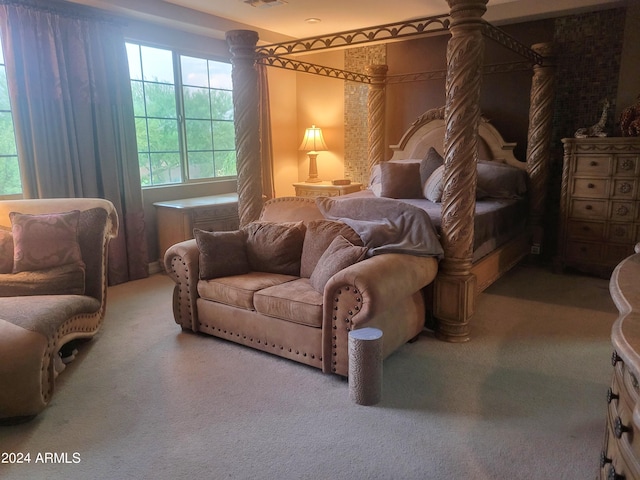 living area featuring visible vents and carpet flooring