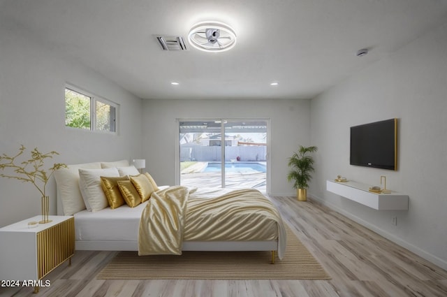 bedroom with light hardwood / wood-style flooring