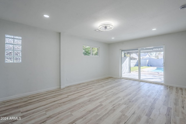 unfurnished room featuring light wood-type flooring