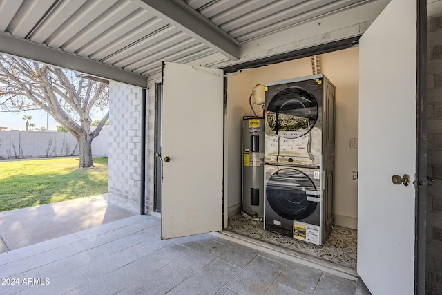 utilities with stacked washer and dryer and electric water heater