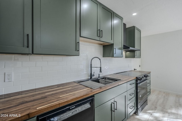 kitchen featuring sink, dishwasher, backsplash, electric range, and wood counters