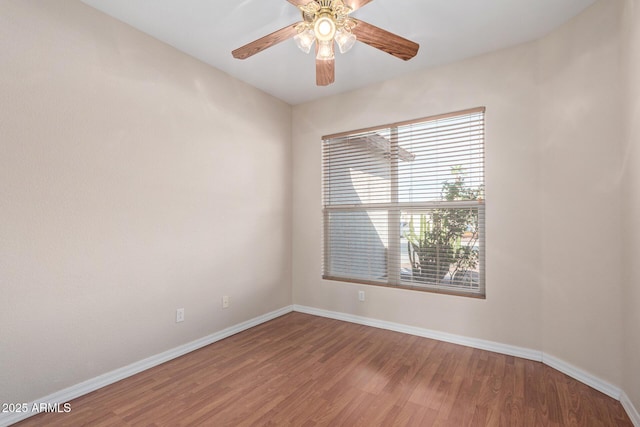 empty room featuring wood-type flooring and ceiling fan