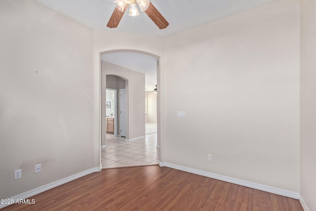 spare room with ceiling fan and light hardwood / wood-style flooring