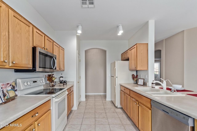 kitchen featuring appliances with stainless steel finishes and sink